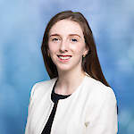 A woman with long brown hair.